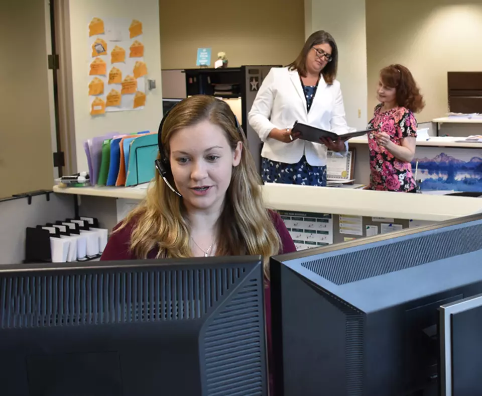 Illinois Municipal Retirement Fund employees working at the call center.