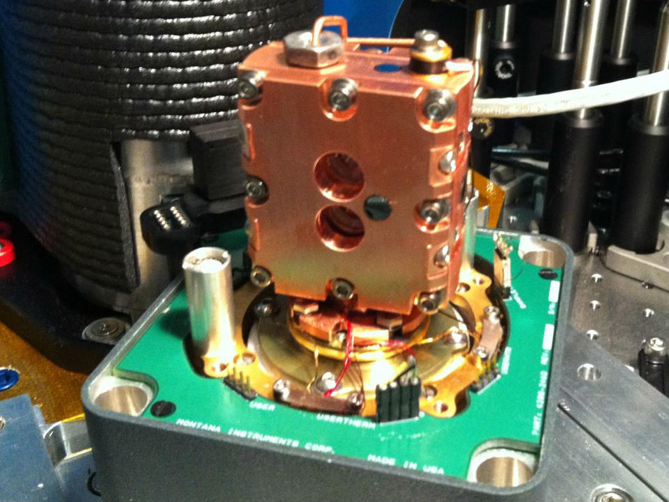 Image shows the housing for the two cryogenically cooled crystals used in a spectral hole burning experiment.