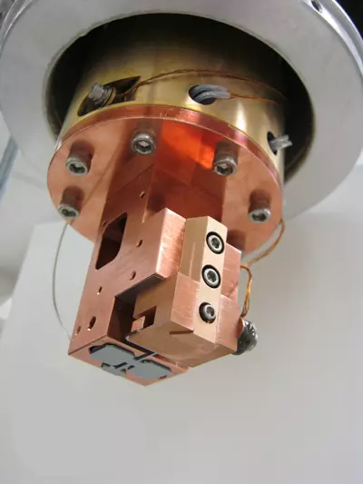 double-paddle oscillator in its mounting, seen from below