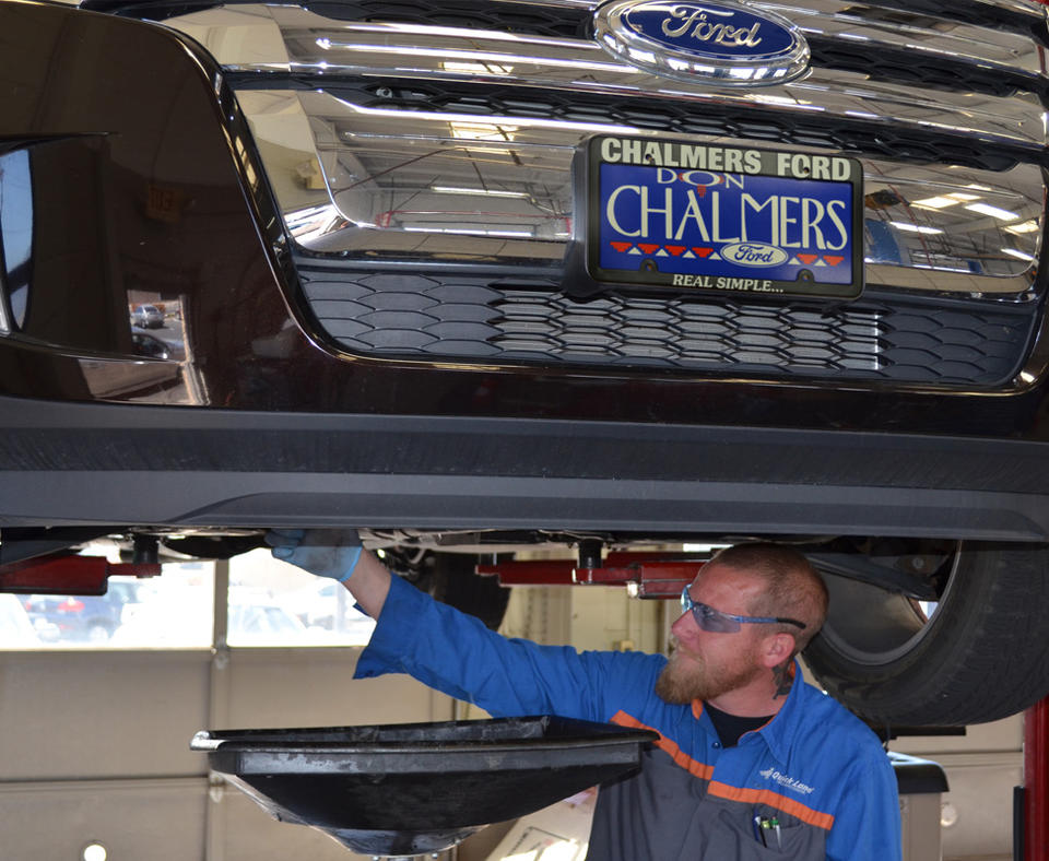 Photo of Don Chalmers Ford mechanic working on a vehicle.