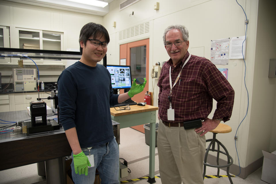 NIST researchers Nam Nguyen and Martin Green showing off their smart window test wafer. 