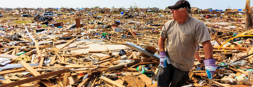 Homeowner looks at the Remain of His Neighborhood
