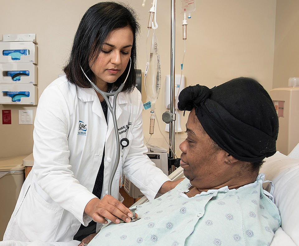 Photo of Memorial Hermann Sugar Land Hospital doctor with patient.