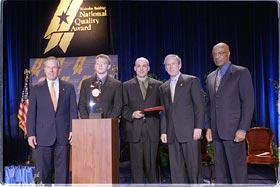 Pictured (Left to right): Commerce Secretary Don Evans; Nathaniel Moore, student, Chugach School District; Richard DeLorenzo, superintendent, Chugach School District; President Bush; Education Secretary Rod Paige.