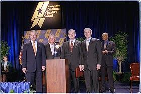 Pictured (Left to right): Commerce Secretary Don Evans; Pal Barger, chairman and founder, Pal's Sudden Service; Thomas Crosby, president and CEO, Pal's Sudden Service; President Bush.