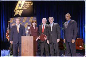 Pictured (Left to right): Commerce Secretary Don Evans; Julie Furst-Bowe, associate vice chancellor, University of Wisconsin-Stout; Charles Sorensen, chancellor, University of Wisconsin-Stout; President Bush; Education Secretary Rod Paige.