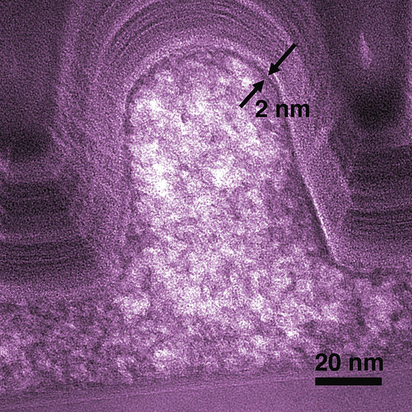 Electron micrograph shows a cross-section of a typical SOG microcircuit feature. 