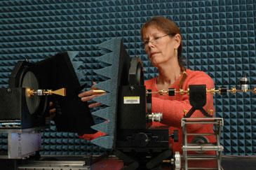 NIST engineer Katherine MacReynolds prepares a new NIST "tabletop" range for characterizing high-performance antennas