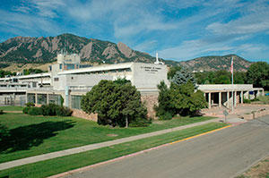 NIST Boulder Building 1, high view from left front, with Flatirons in the background.