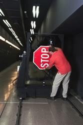 Testing how light reflects off stop signs and other road markings