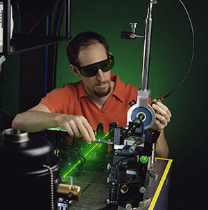 Electrical engineer Richard Mirin aligns a laser