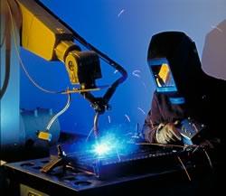 Materials research engineer James Filla monitors a welding robot.