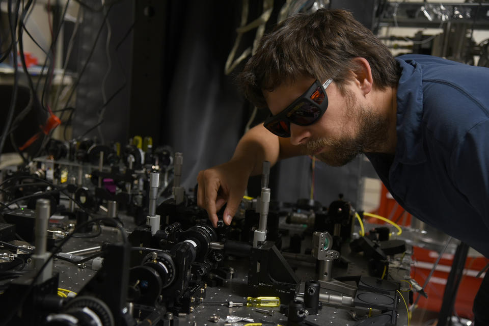 NIST physicist Krister Shalm with the photon source used in the Bell test