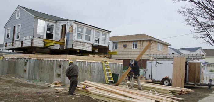 Photo of a home being raised in Seaford, NY, after Hurricane Sandy