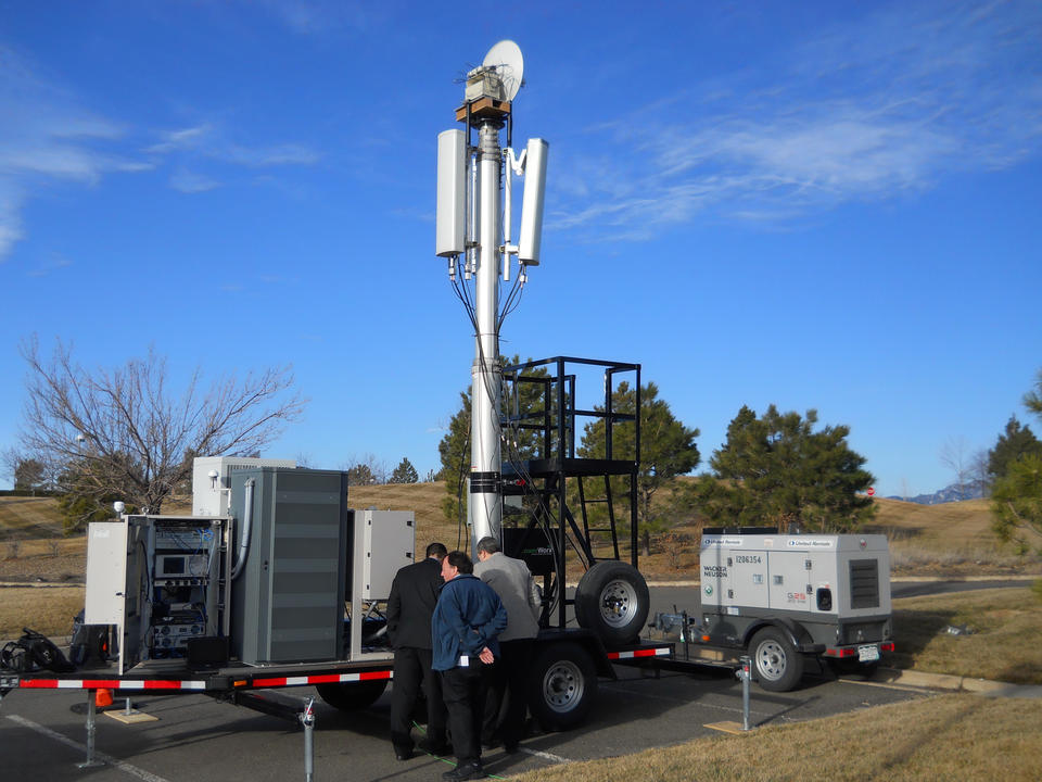 Photo of NIST scientists with the PSCR Deployable LTE Cell-on-Wheels