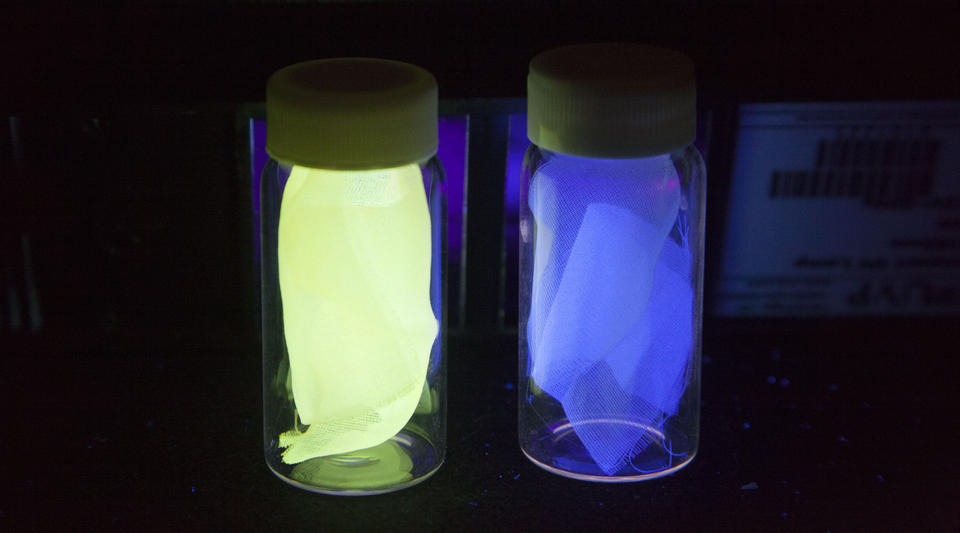 Examples of the silk used in experiments to detect damage in composites, shown under black light.