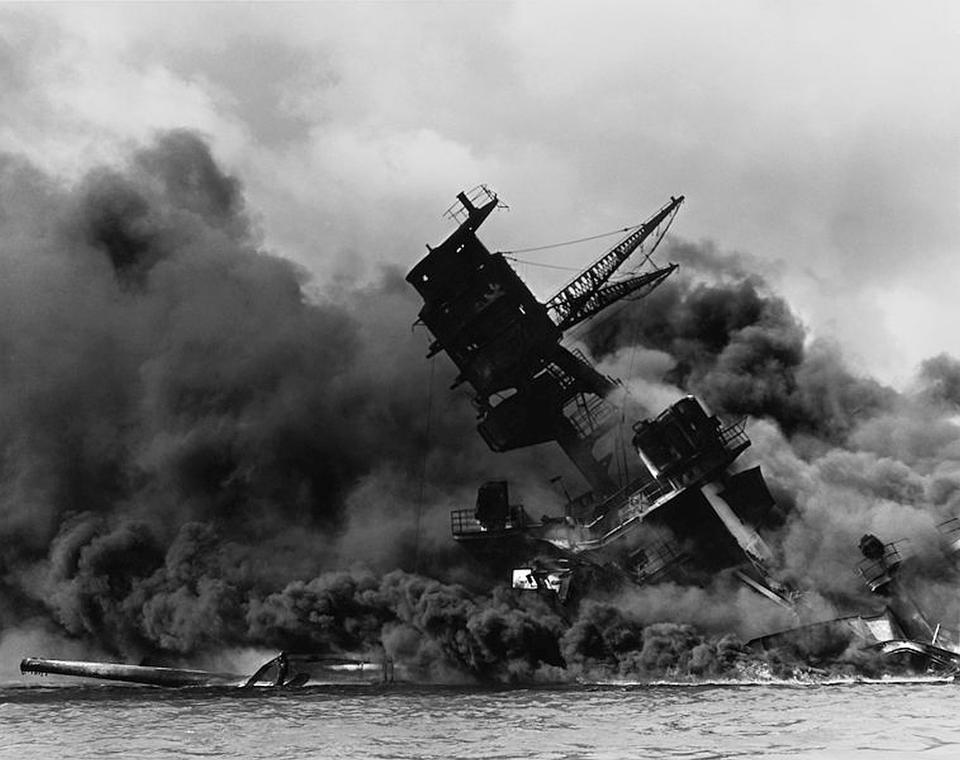 A photo of the USS Arizona burning