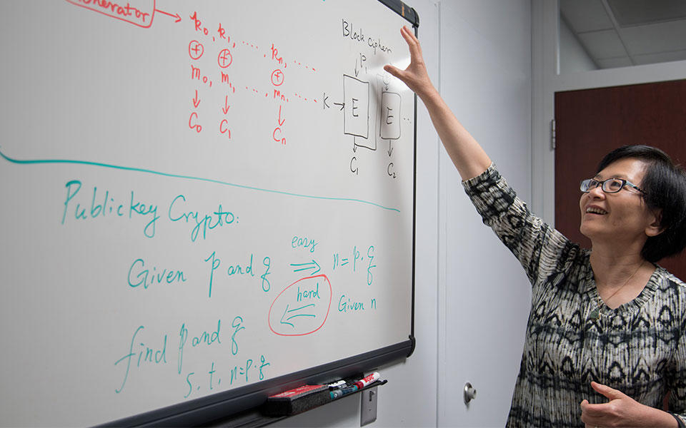 Lily Chen at her whiteboard