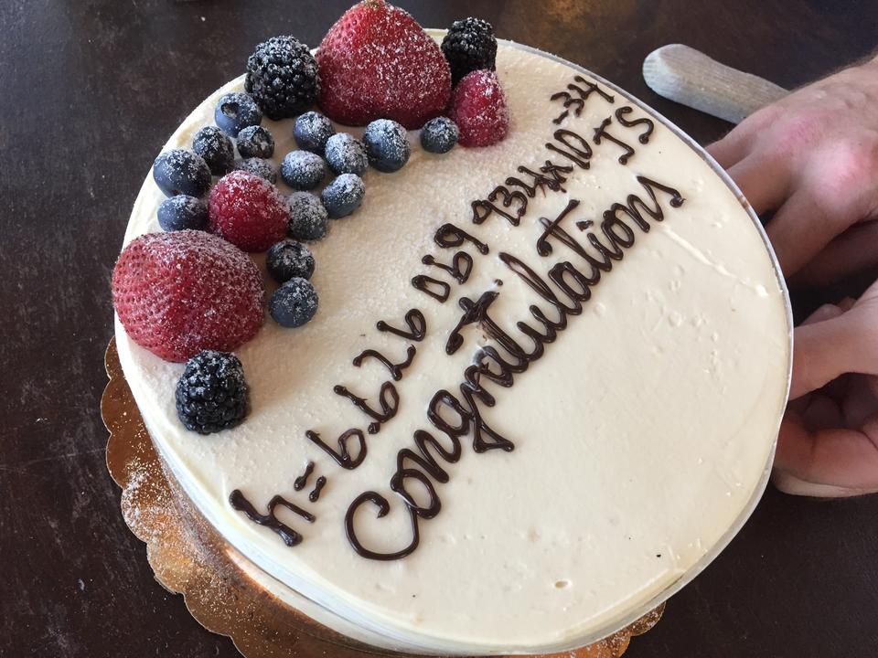 cake with winning guess of Planck's constant value written on it