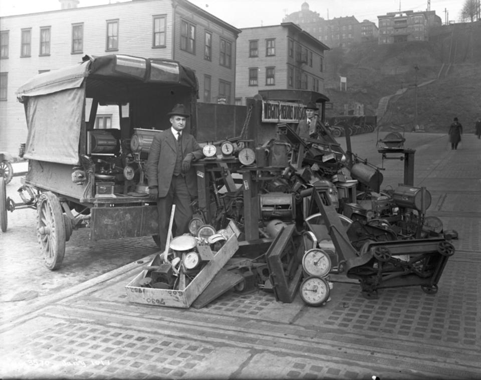 Seattle weights and measures inspectors with condemned scales