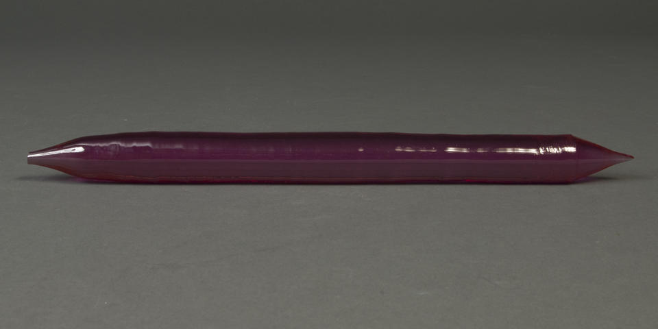A purple crystal cylinder, pointed at the ends
