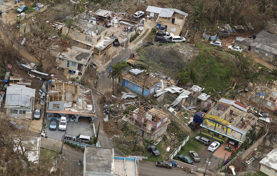 Aerial of buildings destroyed and debri laying around