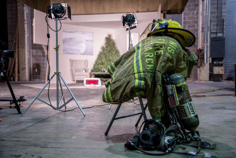 Fire hat, tank and mask and jacket sit ready for use.