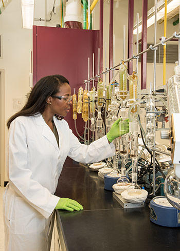 NIST research chemist Jeanita Pritchett extracts nicotine and tobacco-specific compounds from a candidate Standard Reference Material (SRM)