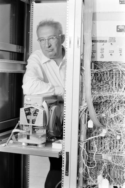 Rabinow leans on his letter sorting machine