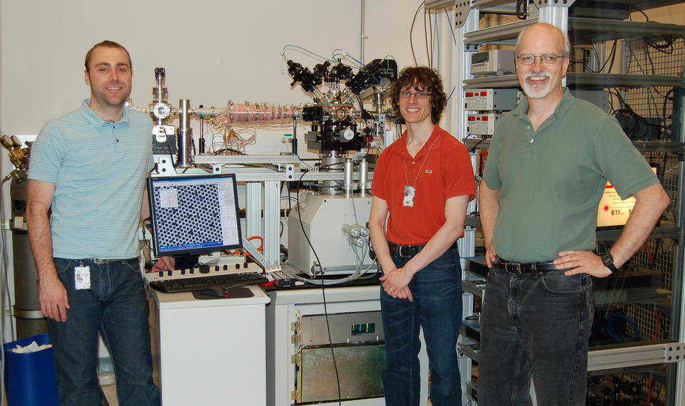 Jabez, McClelland, Adam Steele and Brenton Knuffman pose in their lab with their cesium ion source.