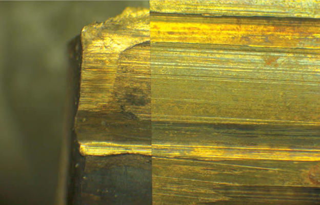 Microscopic comparison of a fragment of a bullet jacket (left) and a test fired bullet from a suspect firearm (right).