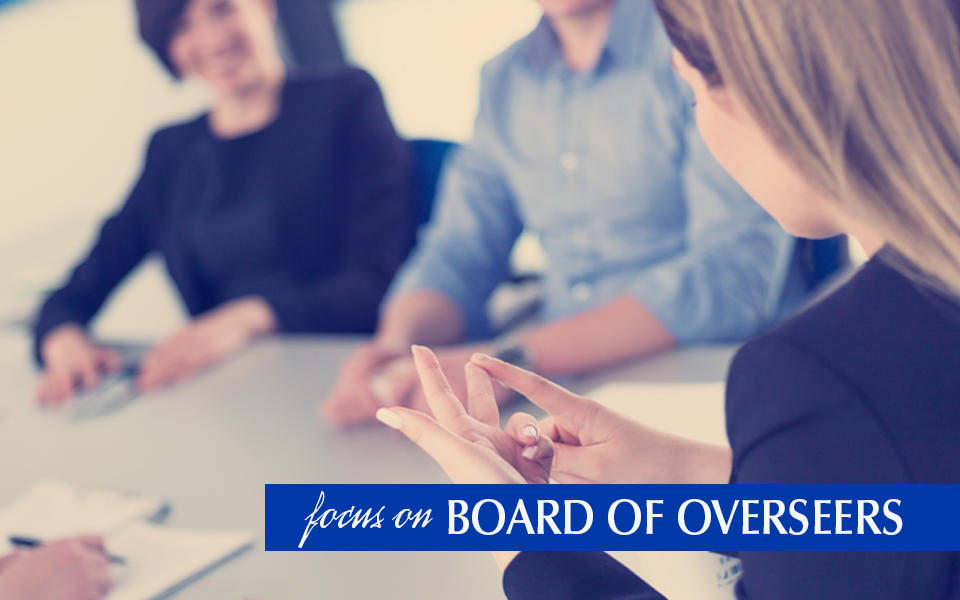 Healthcare Executives sitting at a table having a meeting.