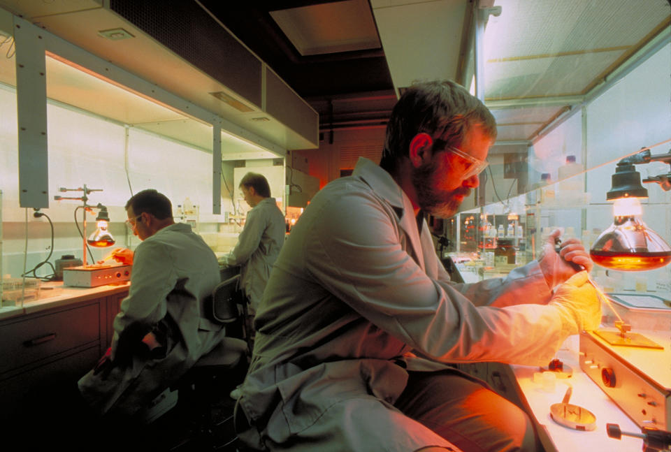 three people at lab benches