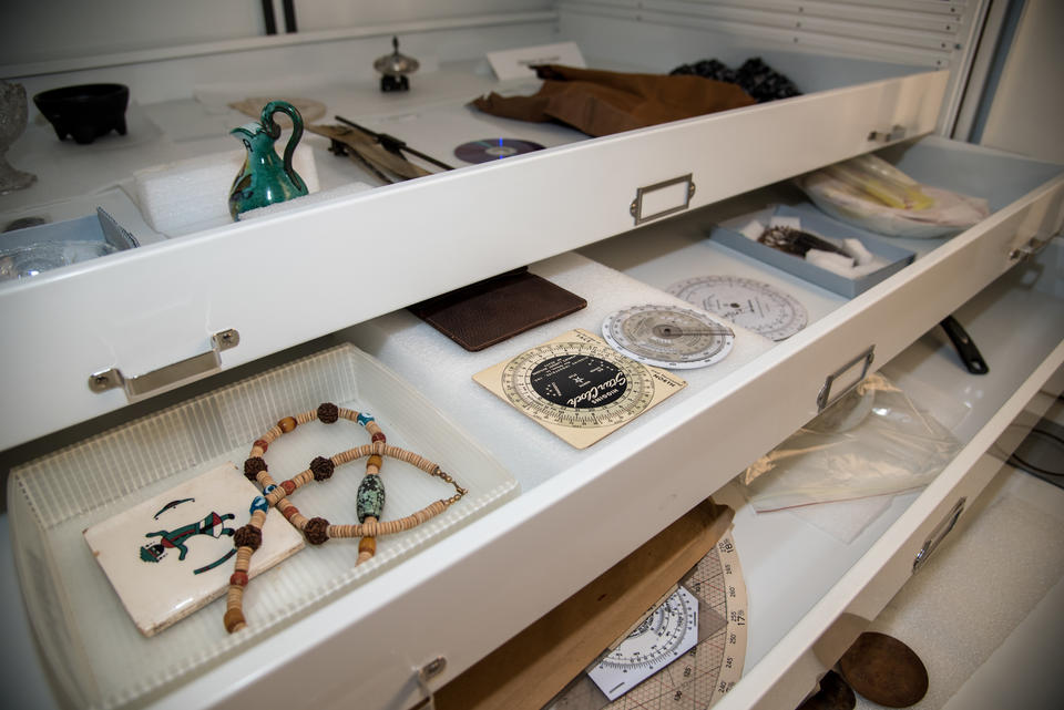 Shelves filled with various faux artifacts