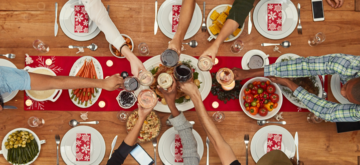 holiday gathering at a table with food and place settings