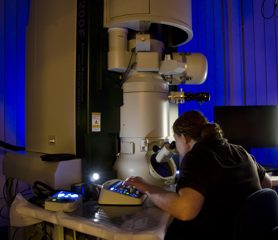 Ann Chiaramonti Debay looks into a TEM