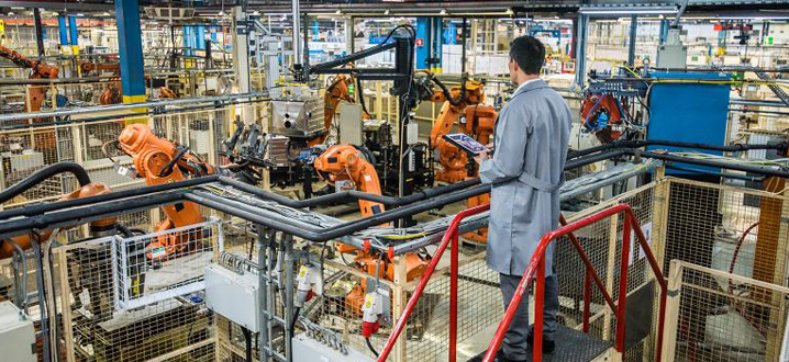 manufacturer looking at automation in a manufacturing facility