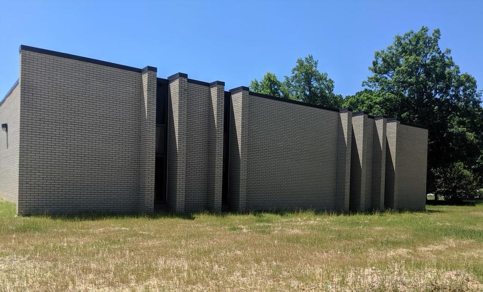 Outside view of windowless brick building