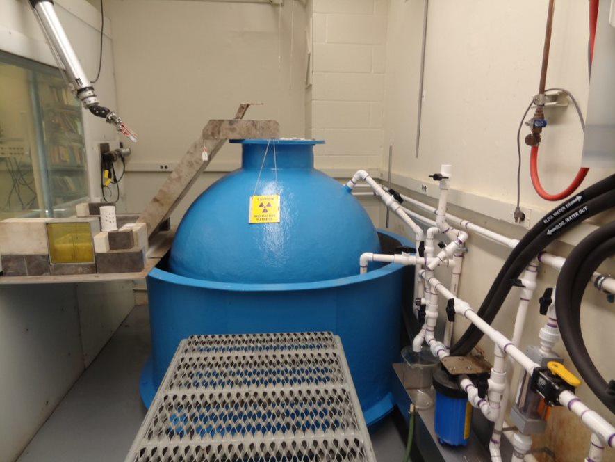 Blue metal spherical tank surrounded by pipes