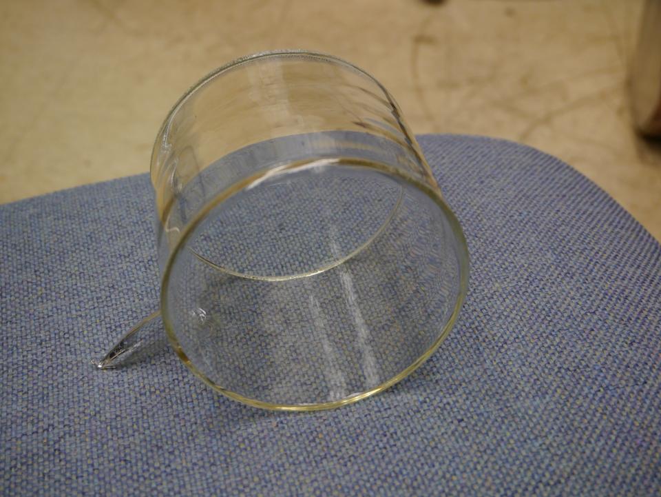 A short glass cylinder