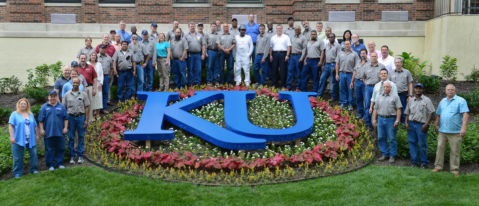 photo outdoors featuring group of facilities workers