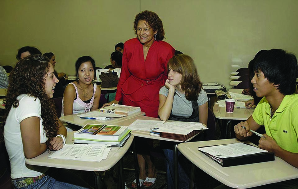 Richland College students interact with an instructor.