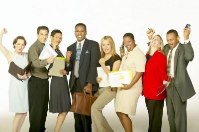 photo of a group of smiling people in business clothes