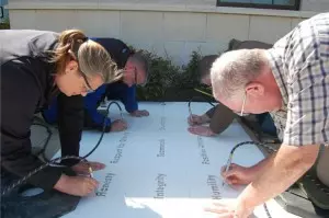 49-midwayusa-employees-engrave-9-company-values-in-campus-sidewalks-300x199.jpg