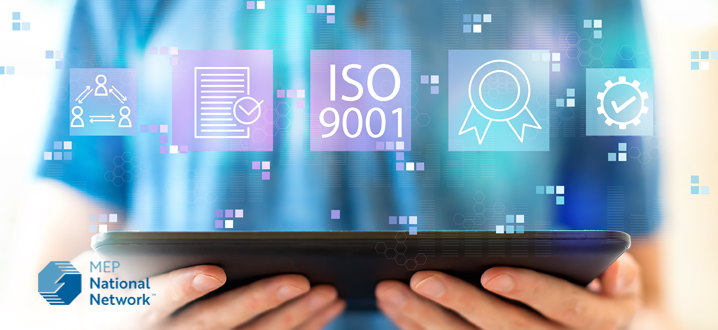 ISO 9001 with man using a tablet stock photo