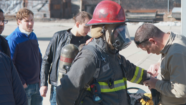 PSCR's Division Chief, Dereck Orr, is outfitted in firefighter gear that's being tested with a haptic feedback user interface. In this case, firefighter gloves contained the haptic feedback technology.