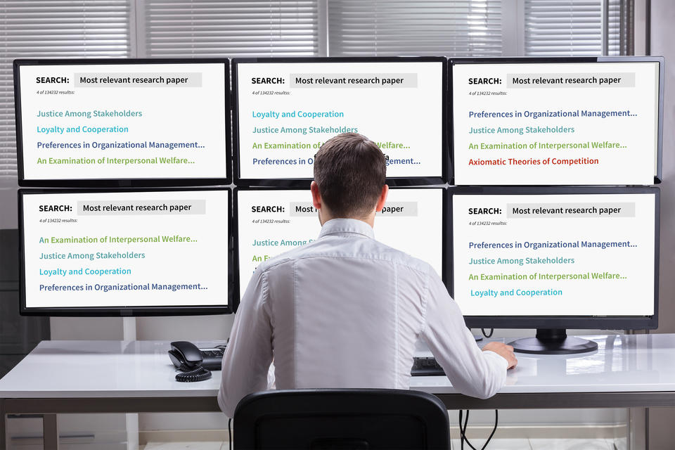 A man facing six computer screens sees six different sets of search results, with each listed item color-coded. 