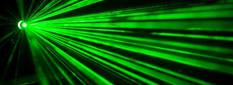 Green Laser Beams Image green laser beams against a black background