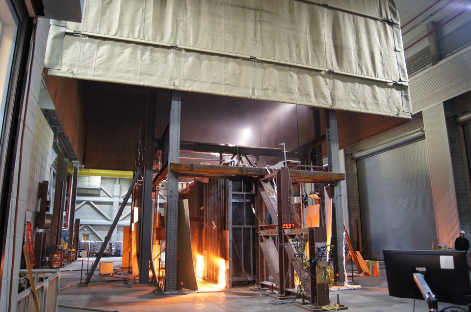 A fire test of an office building floor replica occurring in a fireproof compartment.