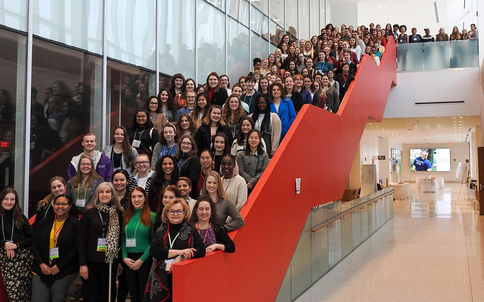 A large gathering of women on a staircase